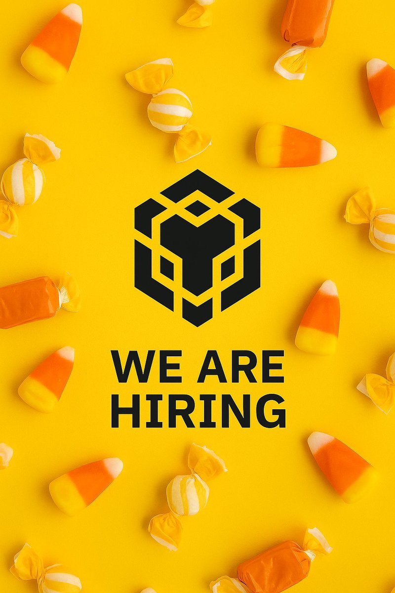 A vibrant yellow background scattered with orange candy corns and wrapped yellow-and-white lollipops, evoking a Halloween theme. Centered is a black hexagonal logo featuring a stylized animal face (resembling a fox or wolf head with angular lines), overlaid with bold black text 'WE ARE HIRING' repeated in large font.